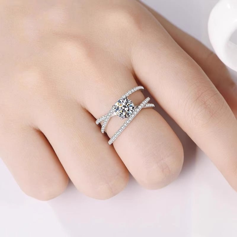 Brilliant Twist Moissanite Ring – Sterling Silver with Side Stones