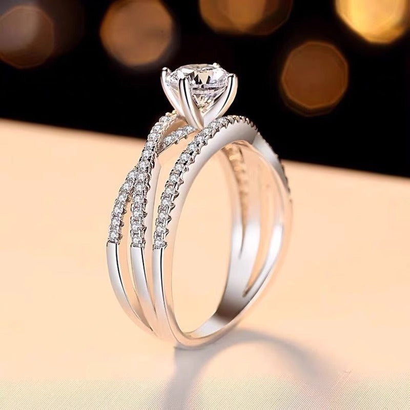 Brilliant Twist Moissanite Ring – Sterling Silver with Side Stones